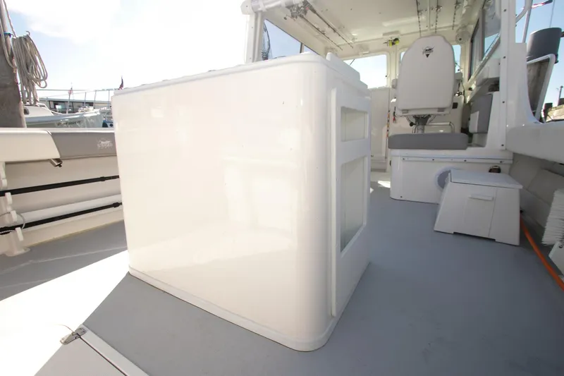 Slide: The Image of 2026 Steiger Craft 31 Miami boat interior with seating and storage. - 48