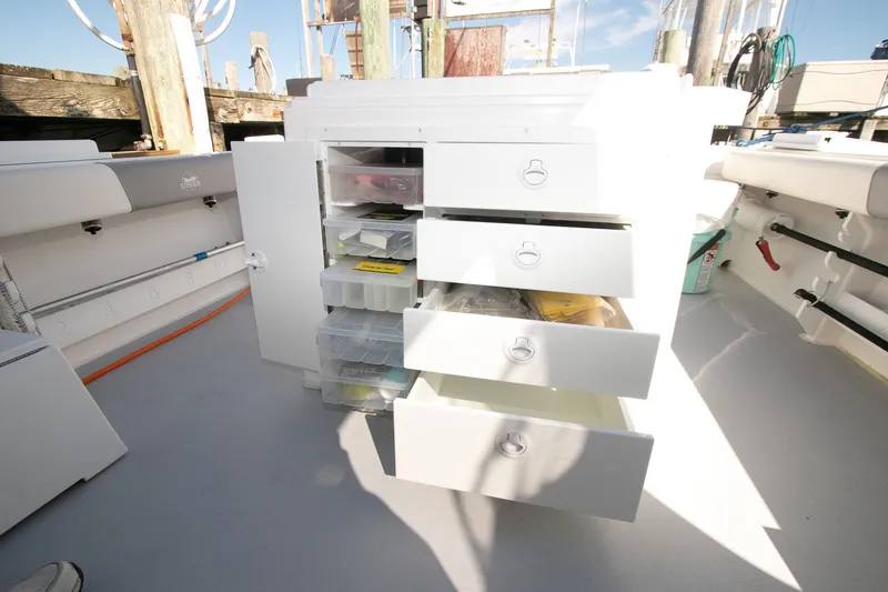 Slide: The Image of Open storage drawers on 2026 Steiger Craft 31 Miami boat deck. - 49