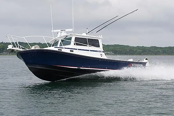 Slide: The Image of 2026 Steiger Craft 31 Miami boat cruising on water, showcasing sleek design and performance. - 8