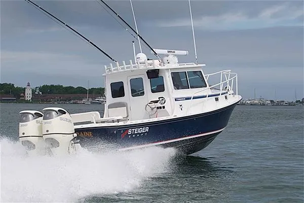 Slide: The Image of 2026 Steiger Craft 31 Miami boat cruising on water with dual engines. - 9