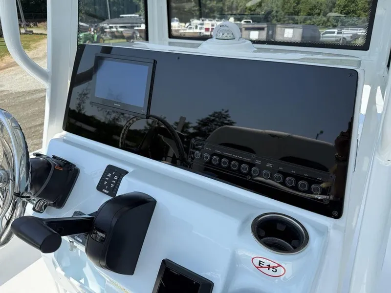Slide: The Image of 2026 Tidewater 2110 BM boat dashboard with steering wheel and control panel. - 16