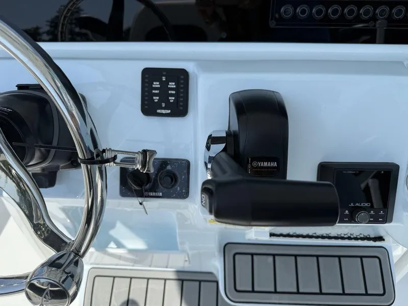 Slide: The Image of Control panel of 2026 Tidewater 2110 BM boat with Yamaha throttle and JL Audio system. - 19