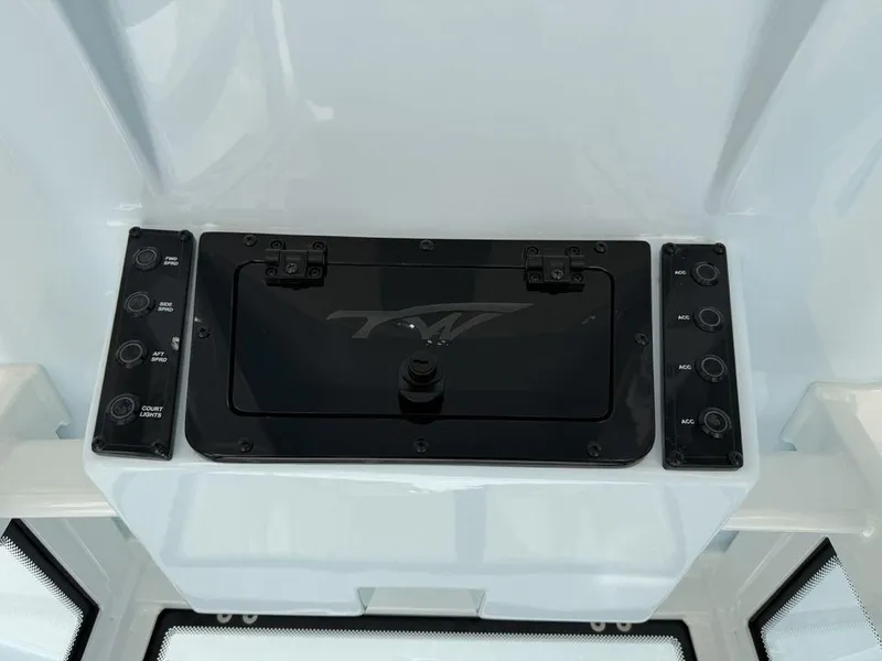 Slide: The Image of Control panel of 2026 Tidewater 2110 BM boat with various switches and compartments. - 21