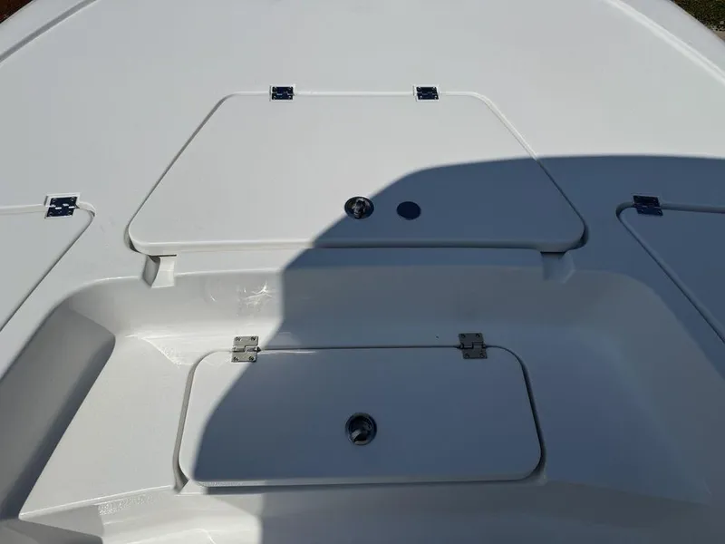 Slide: The Image of 2026 Tidewater 2110 BM boat deck with storage compartments and sleek design. - 6