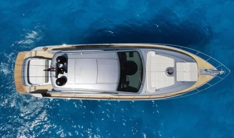 The Image of Top view of a 2022 Pershing 6X yacht on clear blue water. - 0