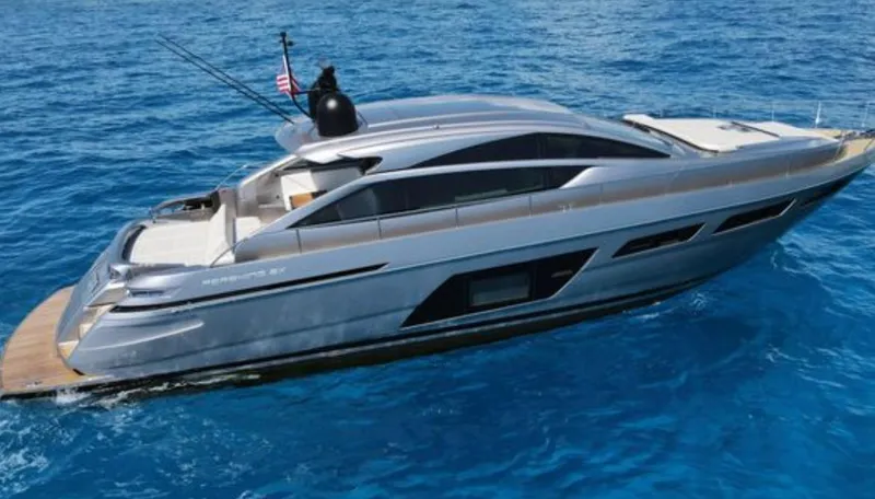 Slide: The Image of 2022 Pershing 6X yacht cruising on clear blue ocean waters. - 1
