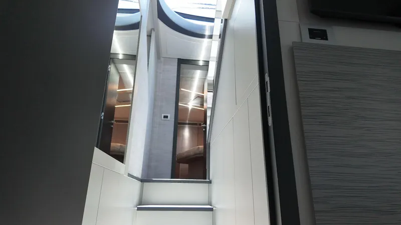 Slide: The Image of Interior view of 2022 Pershing 6X yacht, featuring modern design and sleek finishes. - 10