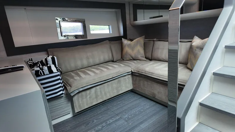 Slide: The Image of Luxurious interior of 2022 Pershing 6X yacht with plush seating and modern design. - 19