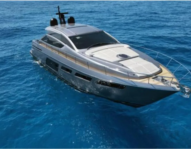 Slide: The Image of 2022 Pershing 6X yacht cruising on clear blue ocean waters. - 2