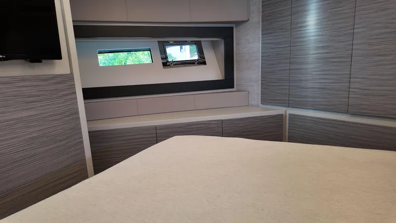Slide: The Image of Luxurious interior of 2022 Pershing 6X yacht with modern design and sleek cabinetry. - 20