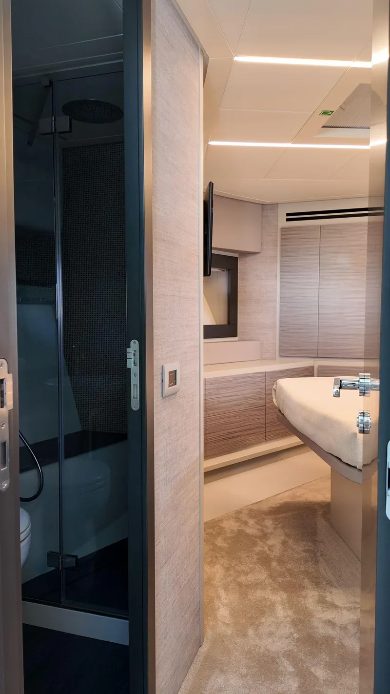 Slide: The Image of Luxurious interior of 2022 Pershing 6X yacht featuring modern design and elegant furnishings. - 29