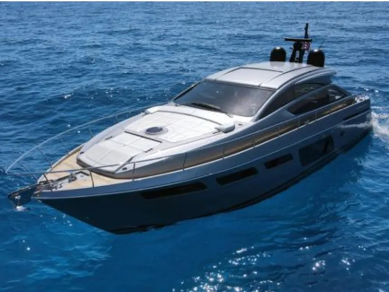 Slide: The Image of 2022 Pershing 6X yacht cruising on clear blue ocean waters. - 3