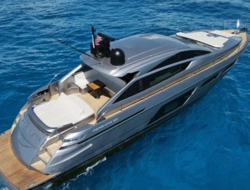 Slide: The Image of 2022 Pershing 6X yacht cruising on clear blue ocean waters. - 4
