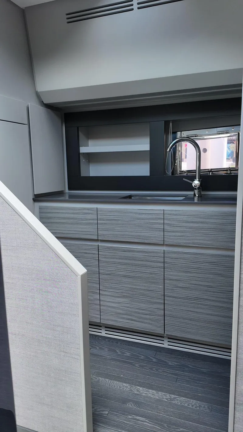 Slide: The Image of Modern kitchen interior of 2022 Pershing 6X yacht with sleek cabinetry and faucet. - 41