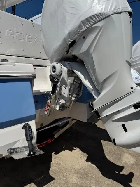 Slide: The Image of 2025 Robalo 246 Cayman boat engine and stern detail in sunlight. - 10