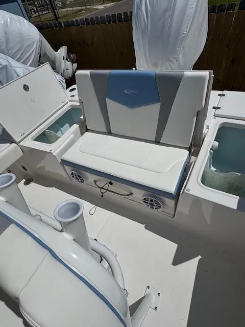 Slide: The Image of 2025 Robalo 246 Cayman boat interior with seating and storage compartments. - 15