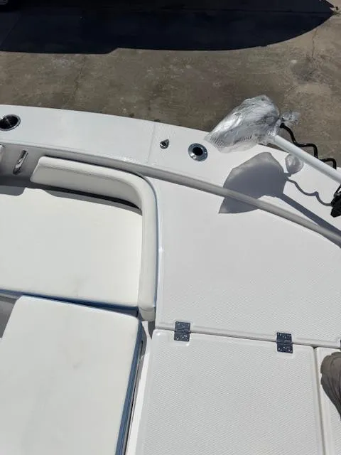 Slide: The Image of 2025 Robalo 246 Cayman boat deck with seating and storage compartments. - 20