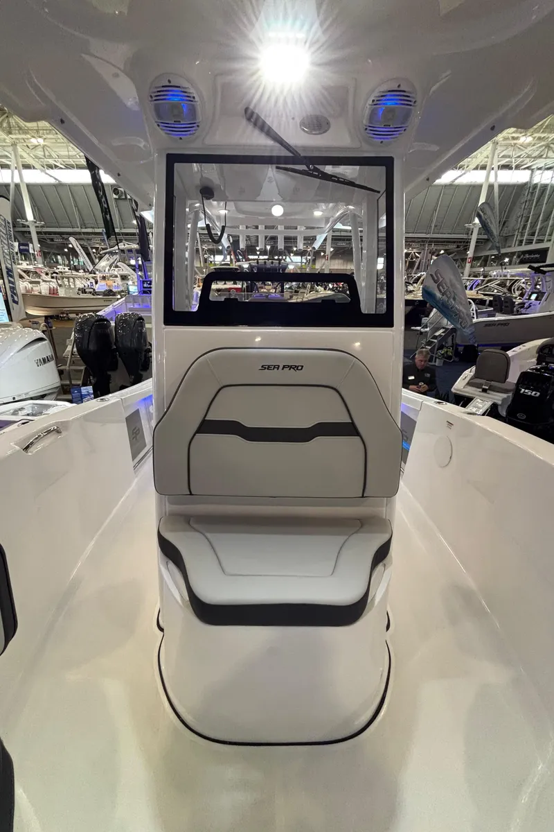 Slide: The Image of 2025 Sea Pro 242 Center Console boat interior with modern seating and controls. - 11