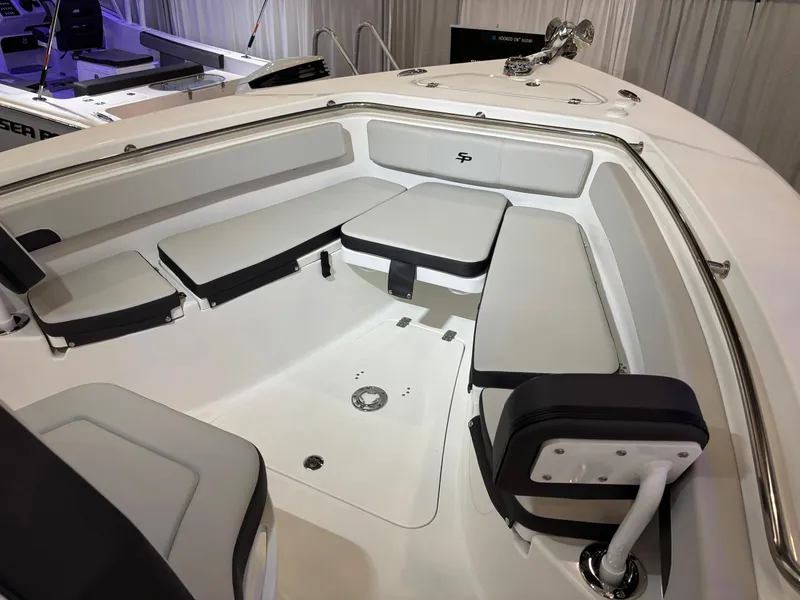 Slide: The Image of 2025 Sea Pro 242 Center Console boat interior with cushioned seating and modern design. - 12