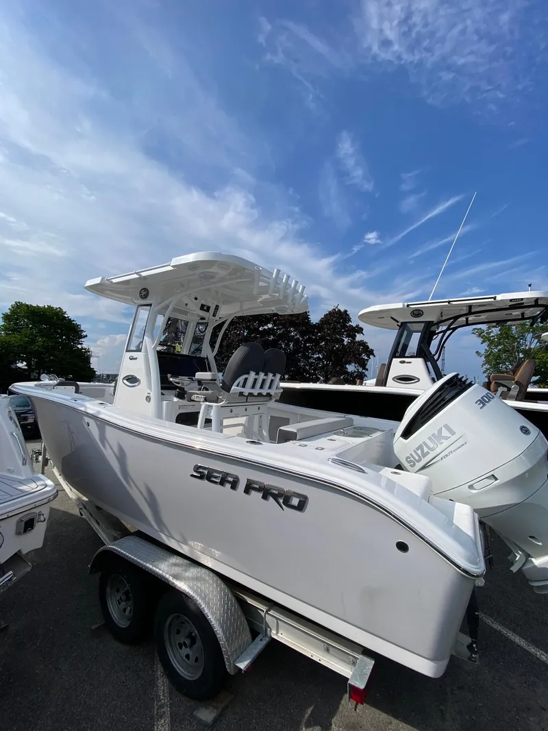 Slide: The Image of 2025 Sea Pro 242 Center Console boat on trailer under blue sky. - 3