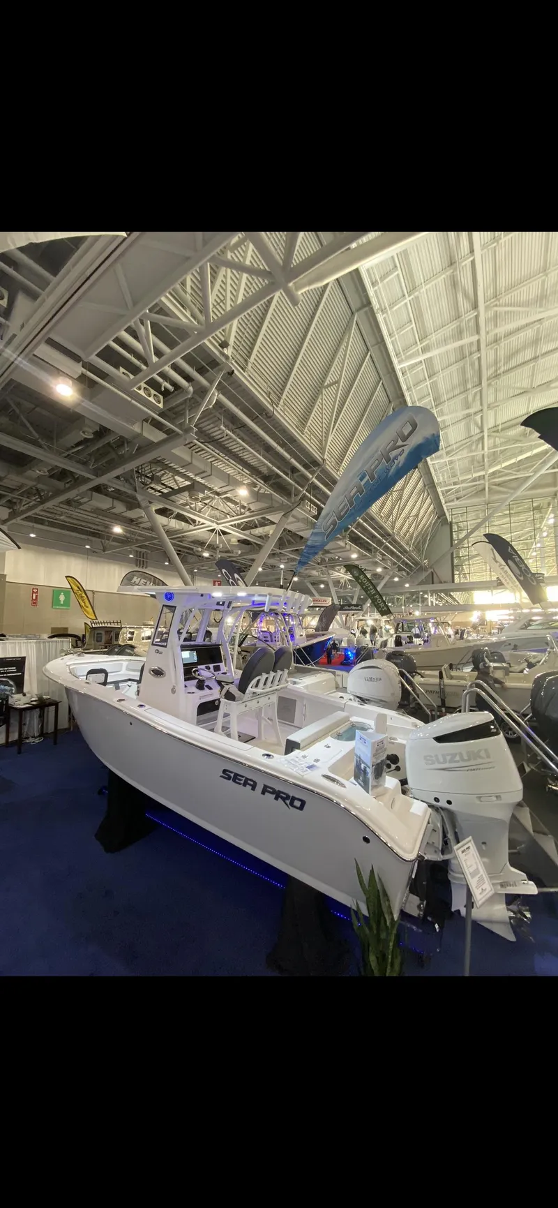 Slide: The Image of 2025 Sea Pro 242 Center Console boat displayed at an indoor exhibition. - 4