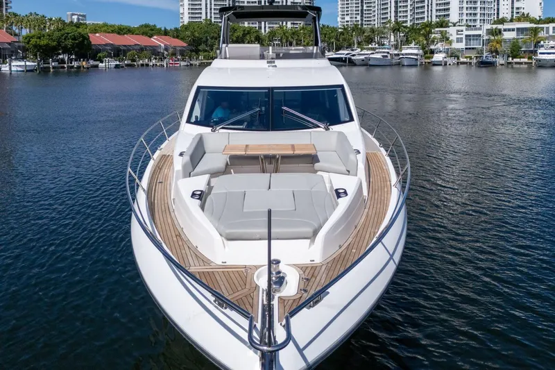 Slide: The Image of 2023 Sunseeker Manhattan 68 Pacific yacht on calm water, showcasing luxury design. - 14