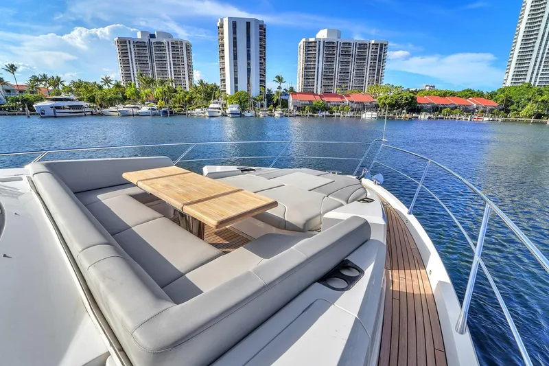 Slide: The Image of Luxurious Sunseeker Manhattan 68 yacht with spacious deck, overlooking waterfront and cityscape, 2023 model. - 16