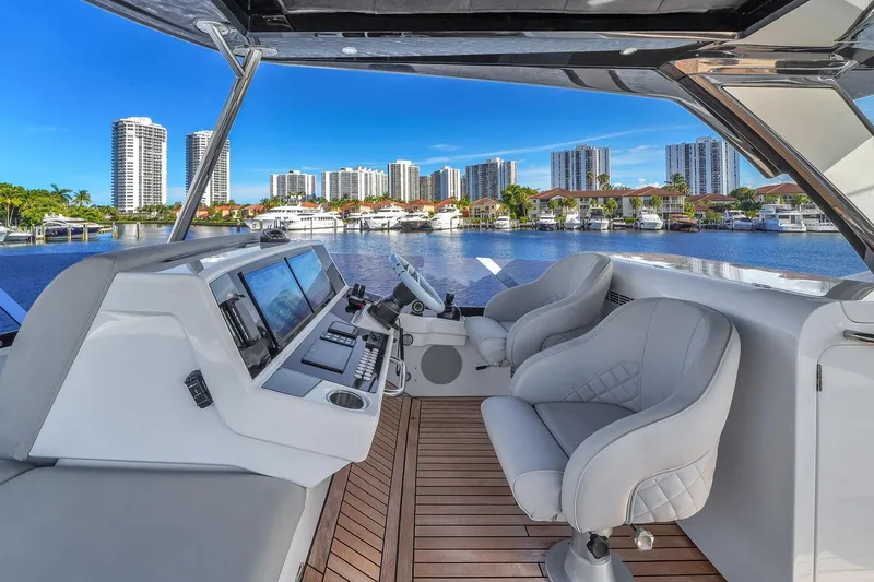 Slide: The Image of Luxurious 2023 Sunseeker Manhattan 68 Pacific yacht interior with waterfront cityscape view. - 30