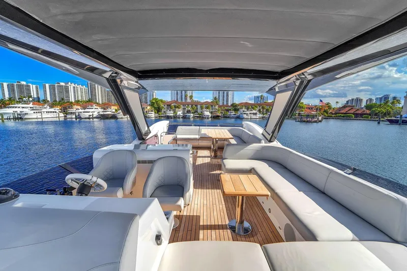 Slide: The Image of Luxurious 2023 Sunseeker Manhattan 68 Pacific yacht interior with spacious seating and scenic marina view. - 31