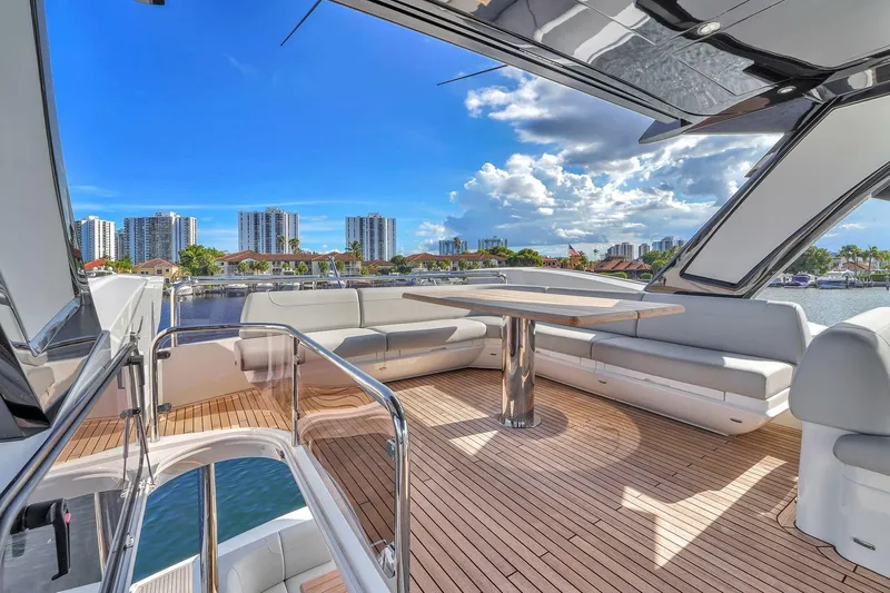 Slide: The Image of Luxurious Sunseeker Manhattan 68 Pacific yacht deck with city skyline, 2023 model. - 33