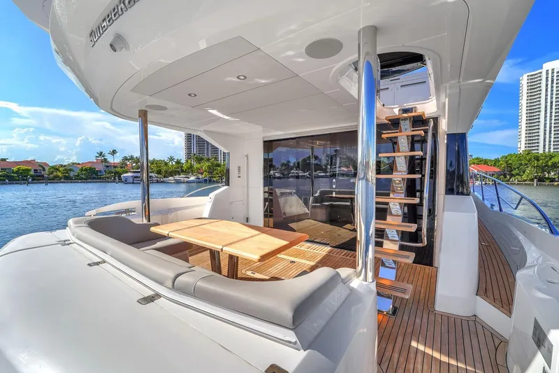 Slide: The Image of Luxurious 2023 Sunseeker Manhattan 68 Pacific yacht deck with seating and scenic waterfront view. - 38