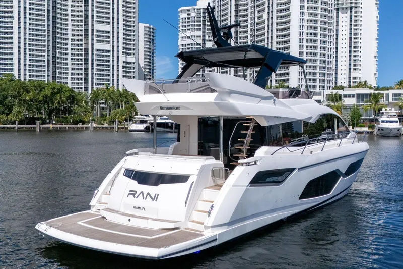 Slide: The Image of 2023 Sunseeker Manhattan 68 Pacific yacht docked in urban marina setting. - 4