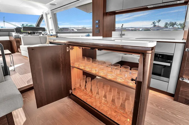 Slide: The Image of Luxurious interior of 2023 Sunseeker Manhattan 68 Pacific yacht with elegant bar setup. - 48