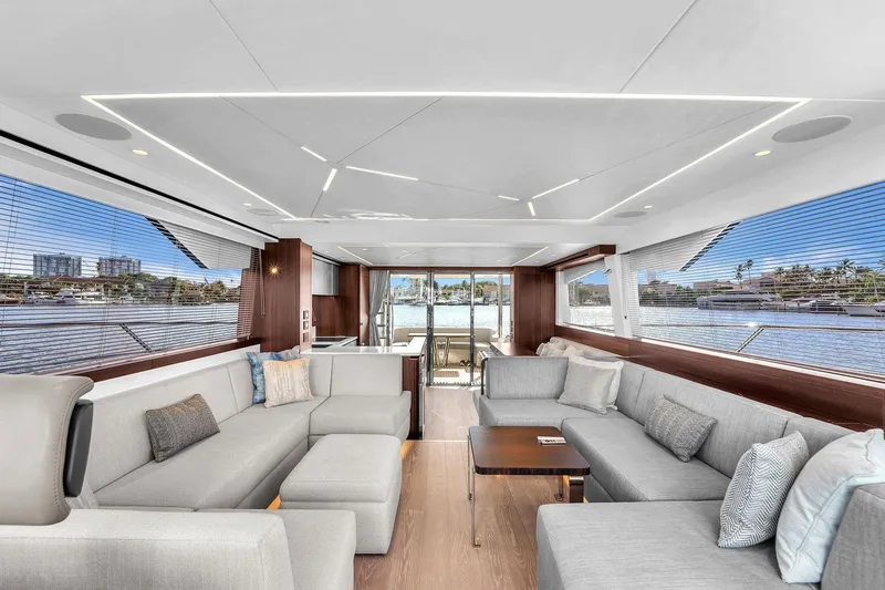 Slide: The Image of Luxurious interior of 2023 Sunseeker Manhattan 68 Pacific yacht with modern seating and panoramic windows. - 51