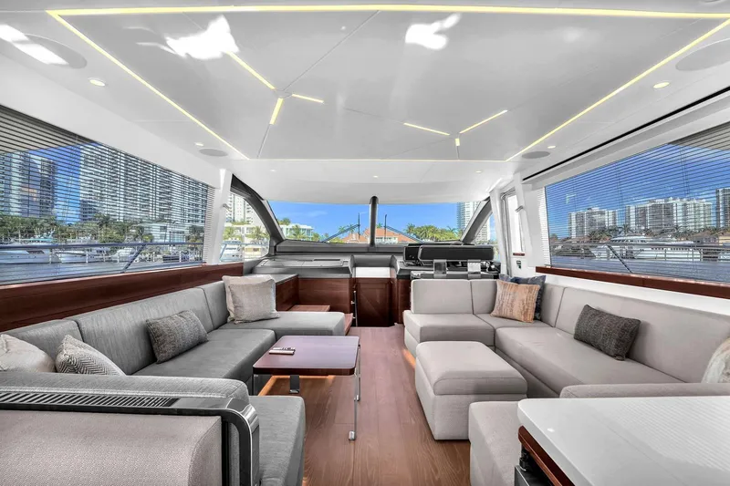 Slide: The Image of Luxurious interior of 2023 Sunseeker Manhattan 68 Pacific yacht with modern seating and large windows. - 54