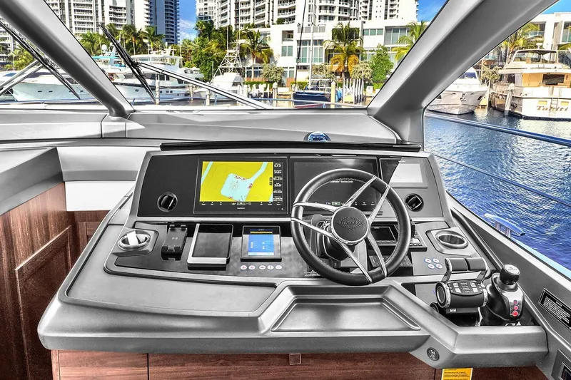 Slide: The Image of Control panel of 2023 Sunseeker Manhattan 68 Pacific yacht, featuring advanced navigation systems. - 59