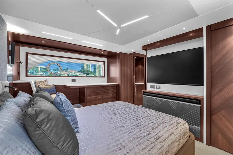 Slide: The Image of Luxurious bedroom interior of 2023 Sunseeker Manhattan 68 Pacific yacht, featuring modern design and large window. - 70