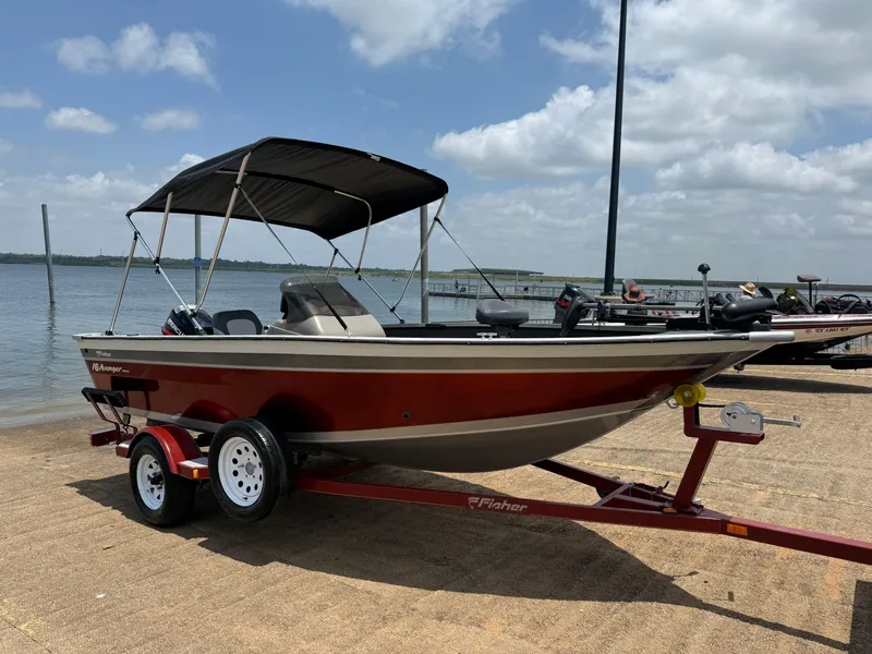 Slide: The Image of Fisher 16 Pro Avenger 2002 boat on trailer by lakeside. - 0