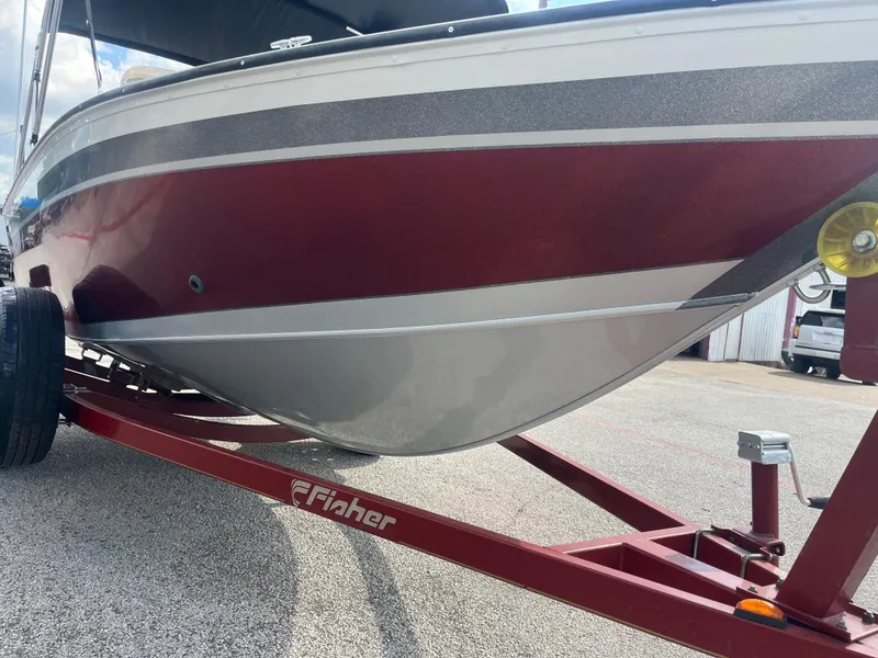 Slide: The Image of Close-up of a 2002 Fisher 16 Pro Avenger tire with detailed tread pattern. - 20