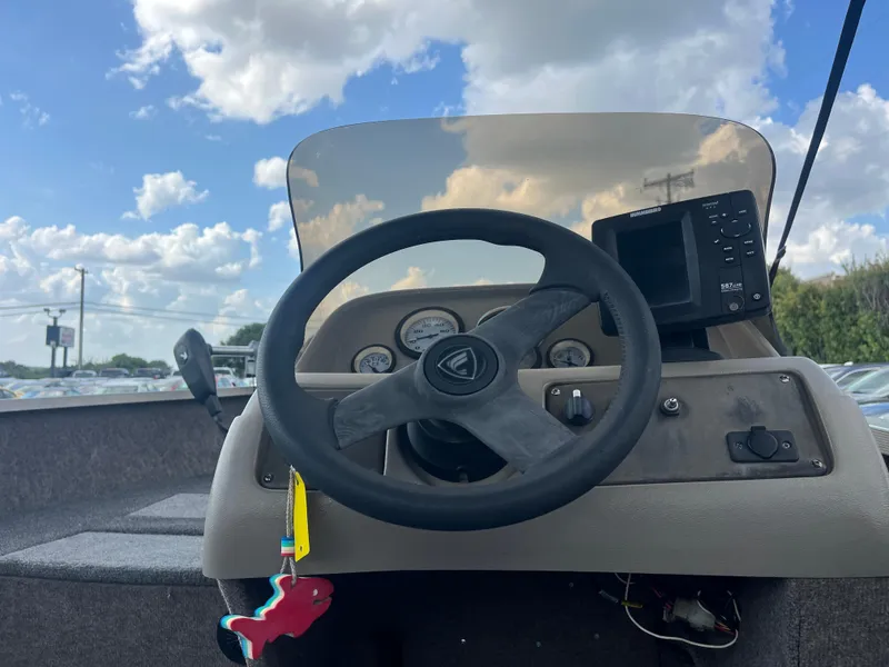 Slide: The Image of 2002 Fisher 16 Pro Avenger boat on a red trailer, close-up view. - 23