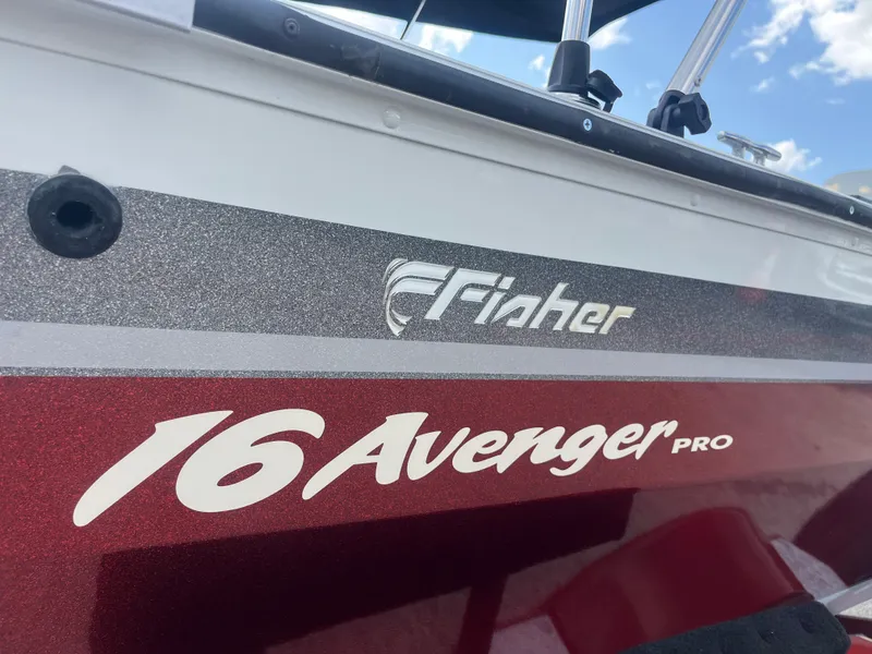 Slide: The Image of Interior of a 2002 Fisher 16 Pro Avenger boat with gray and white seating. - 25
