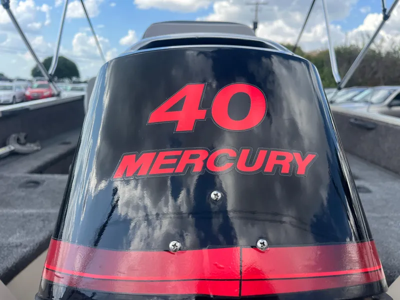 Slide: The Image of Outboard motor on 2002 Fisher 16 Pro Avenger boat, featuring "40 Mercury" branding. - 28