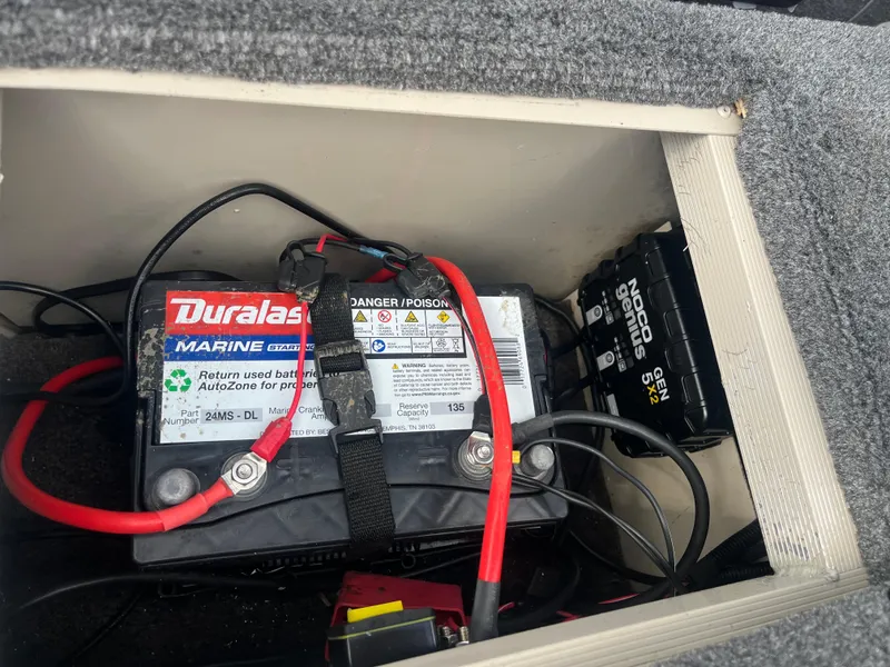 Slide: The Image of Bimini top of 2002 Fisher 16 Pro Avenger boat against a cloudy sky. - 34