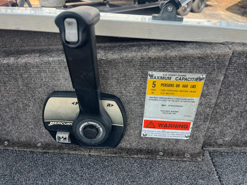 Slide: The Image of Marine battery setup in a 2002 Fisher 16 Pro Avenger boat compartment. - 36