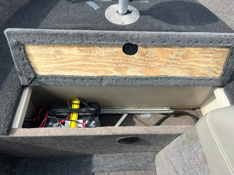 Slide: The Image of 2002 Fisher 16 Pro Avenger boat interior with steering wheel, gauges, and seating. - 40