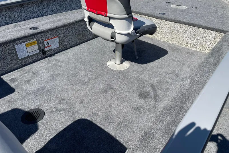 Slide: The Image of 2015 Tracker GV16 LAKER DLX boat interior with gray carpet and seating. - 5