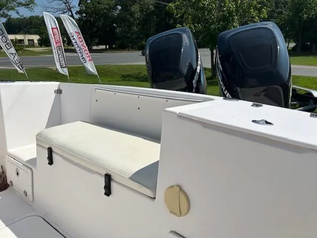 Slide: The Image of 2005 Pro-Line 29 Super Sport boat with dual outboard motors and cushioned seating. - 5