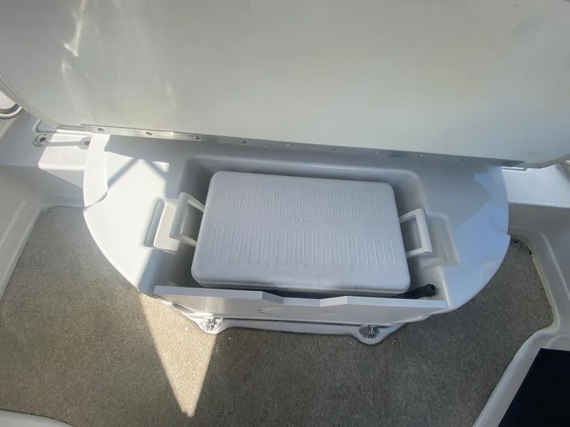 Slide: The Image of Storage compartment with Igloo cooler on 2006 Crownline 320 LS boat. - 14