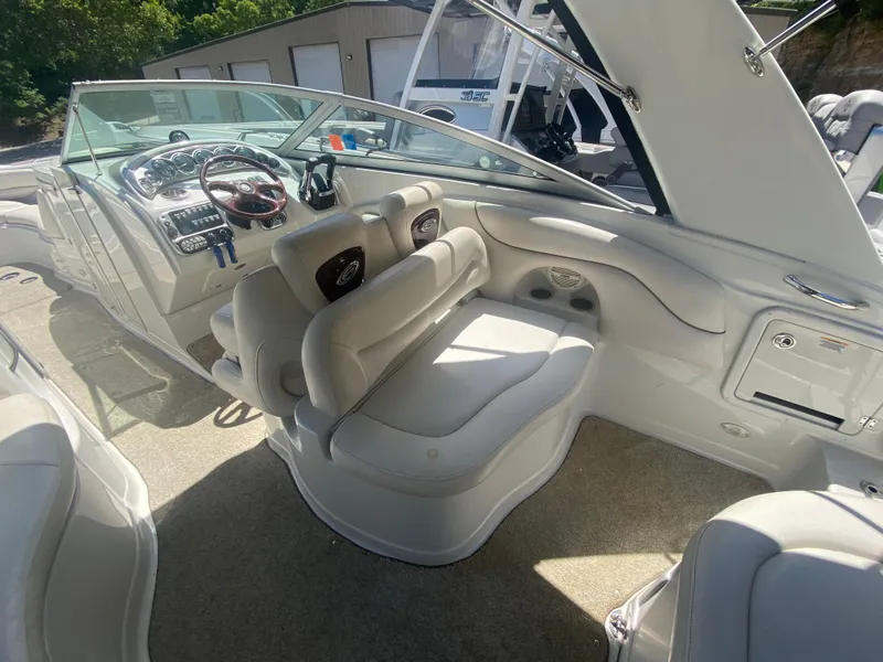 Slide: The Image of 2006 Crownline 320 LS boat interior with plush seating and modern dashboard controls. - 15