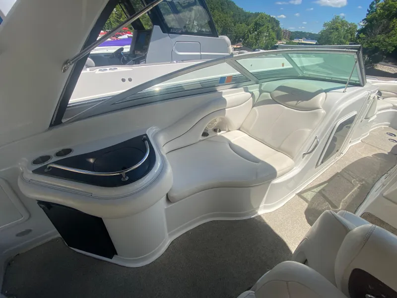 Slide: The Image of 2006 Crownline 320 LS boat interior with white seating and sleek design. - 20